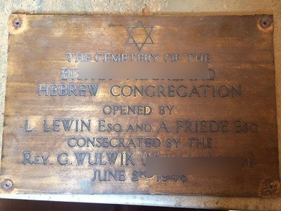 A historical brass plaque saved and returned during a probate clearance